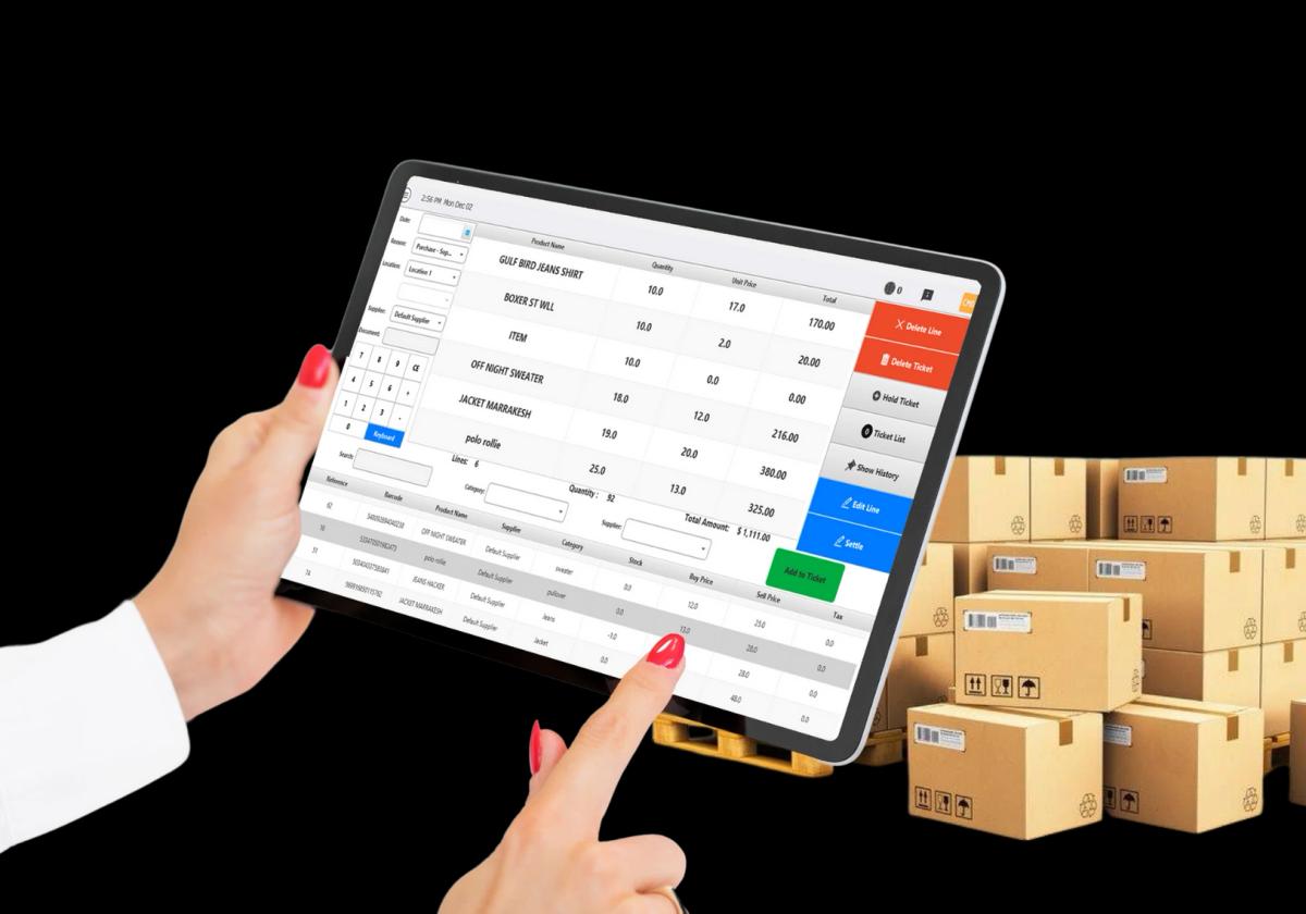 Finger tapping on tablet with inventory boxes in background
